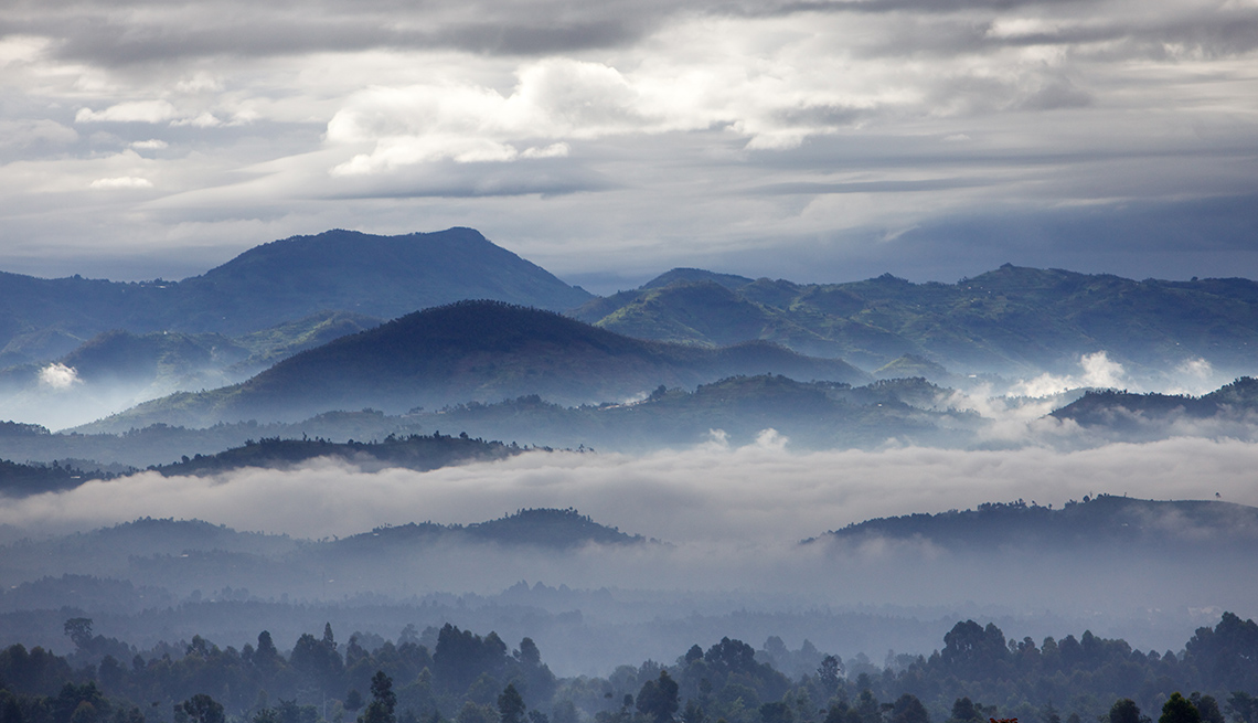 item 12 of Gallery image - Aerial View Of Mist, Clouds And Sky Over Virunga Volcano In Rwanda, Under The Radar Destinations