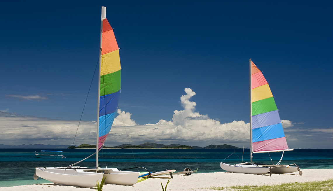 Two Catamarans Sit On The Beach On Mamanuca Beach In Fiji, World's Best Beaches