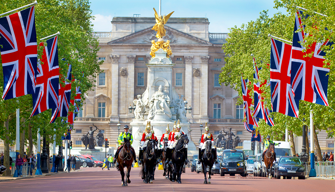 horses and riders parade near Buckingham Palace 