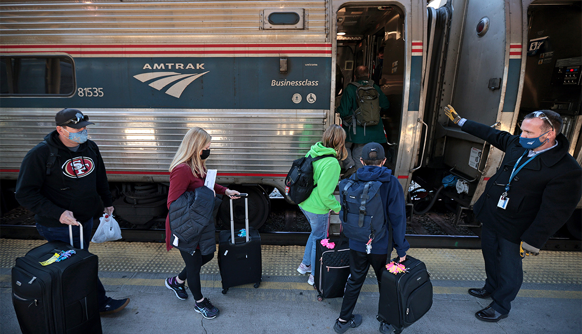 Passengers board a train bound for Boston on the day before Thanksgiving at Union Station on November 24, 2021 in Washington, DC. 