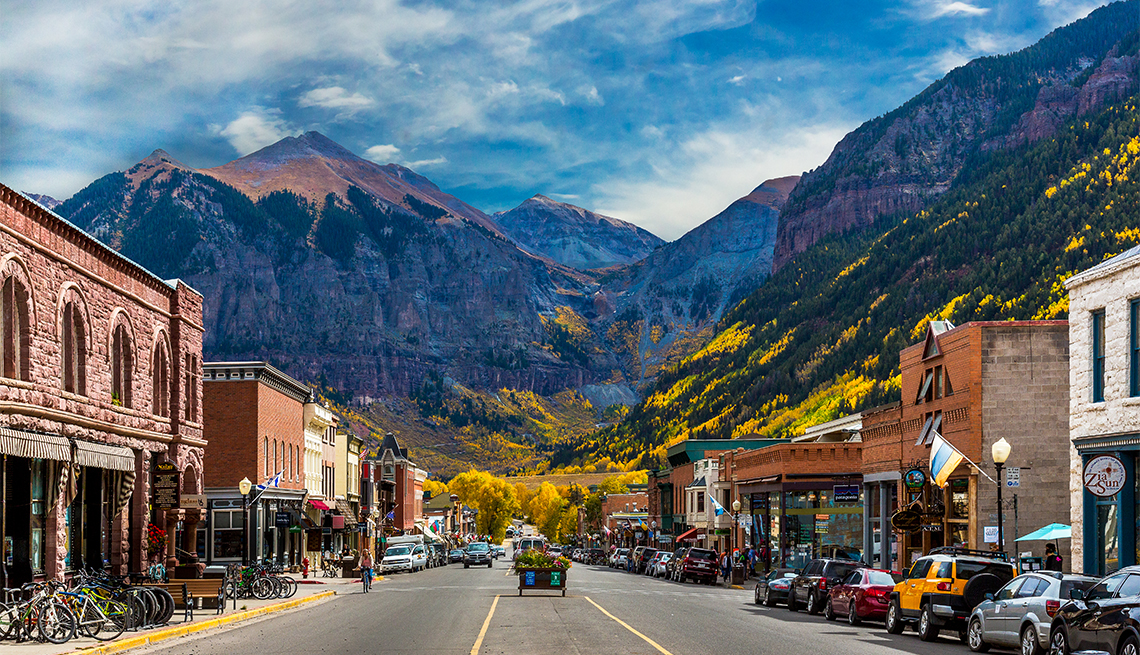 A look down Main Street in Telluride during Peak Autumn Color from the Aspens with a mountain backdrop