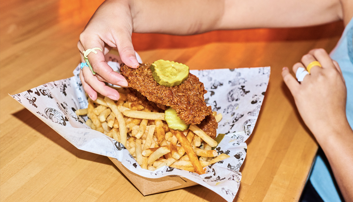 hot chicken over fries with pickles from wolfies in los angeles california