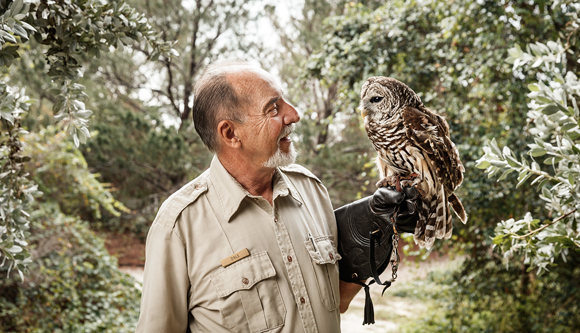 Park Ranger Dale Klco holding an owl at the Hobe Sound National Wildlife Refuge and Nature Center