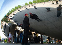 People crowd around Anish Kapoor's "Cloud Gate" in Chicago's Millenium Park.