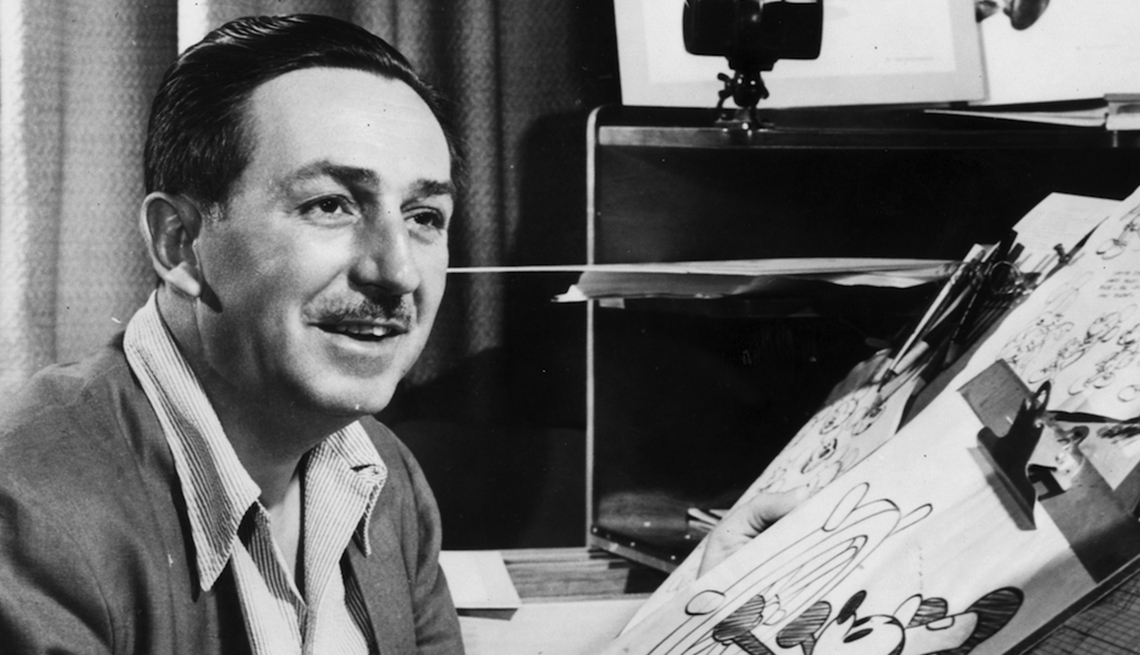 Animator Walt Disney at the drawing board