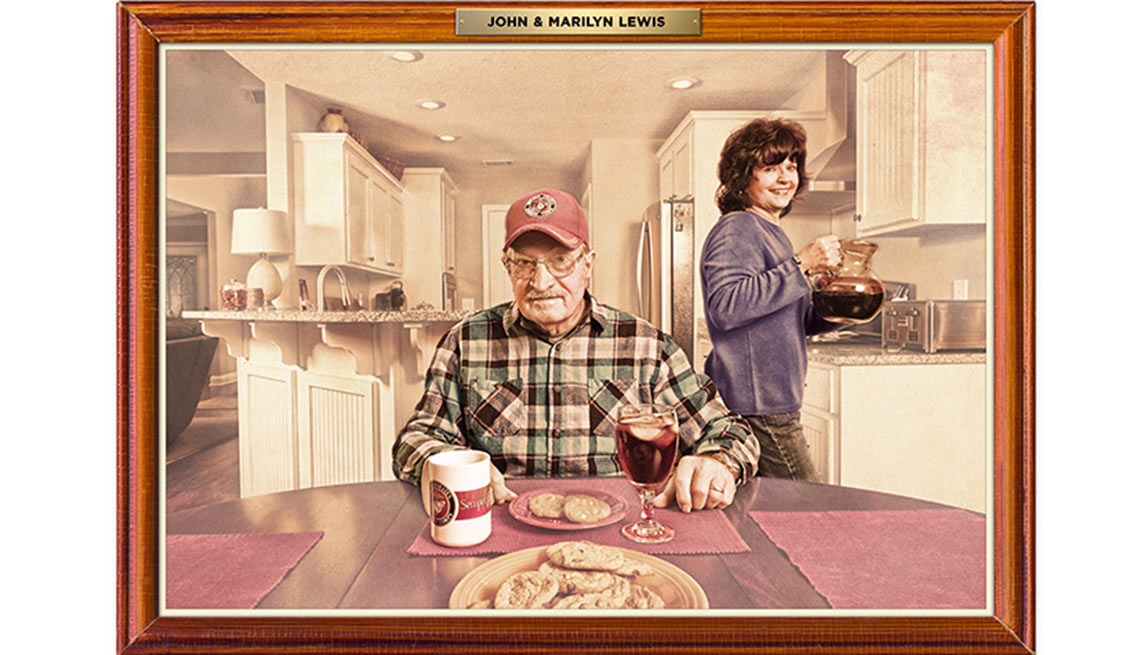 Man Sits At His Kitchen Table Eating A Meal With His Wife In The Background, AARP Money, Work And Retirement, The Home You Want With The Money You Have