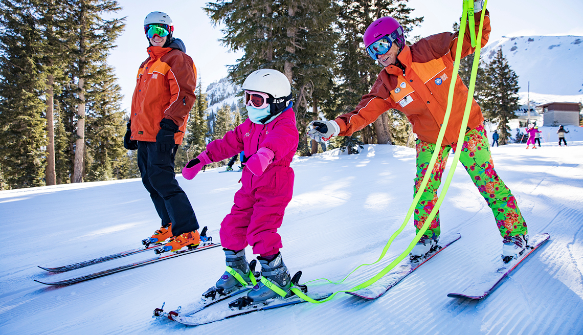item 6 of Gallery image - ski instructors help child ski 