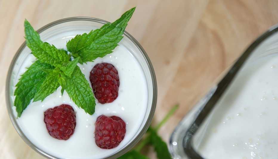 kefir drink with raspberries and mint leaf