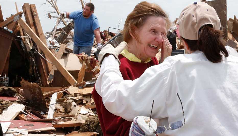 Christine Jones, Ann Worden, crying, demolished home, Moore, Oklahoma, Tornado, AARP Foundation, Disaster Relief Christine Jones, Ann Worden, crying, demolished home, Moore, Oklahoma, Tornado, AARP Foundation, Disaster Relief