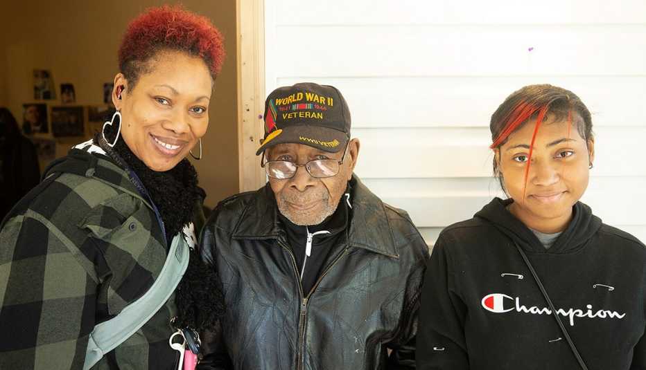 Frederick Lonzo poses with daughter Leah and granddaughter Tehlyr outside his rebuilt home. Frederick Lonzo poses with daughter Leah and granddaughter Tehlyr outside his rebuilt home.