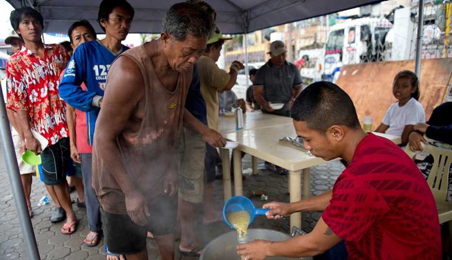 Food distribution, Typhoon Haiyan, Tacloban, Phillipines, AARP Foundation, Disaster Relief Food distribution, Typhoon Haiyan, Tacloban, Phillipines, AARP Foundation, Disaster Relief