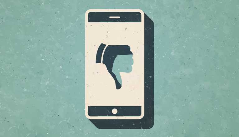 Icon of "Smartphone with thumbs down" in a trendy vintage style. Beautiful retro illustration with old textured paper and a black long shadow.