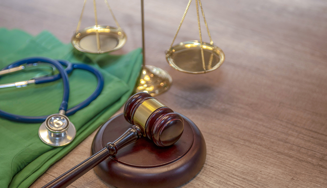 Medical law concept, Gavel and stethoscope in background.