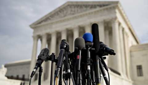 Television microphones stand outside the U.S. Supreme Court in Washington, D.C.