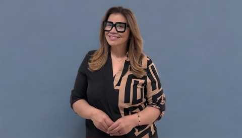 America Arevalo, BACK TO WORK50+ female coach wearing a dress