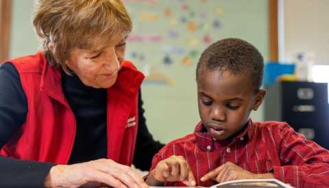 Meg Quinn tutoring a child in Buffalo, New York for AARP Foundation Experience Corps.