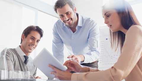 Business meeting, using tablet, Corporate Philanthropy, Ways to Give, AARP Foundation