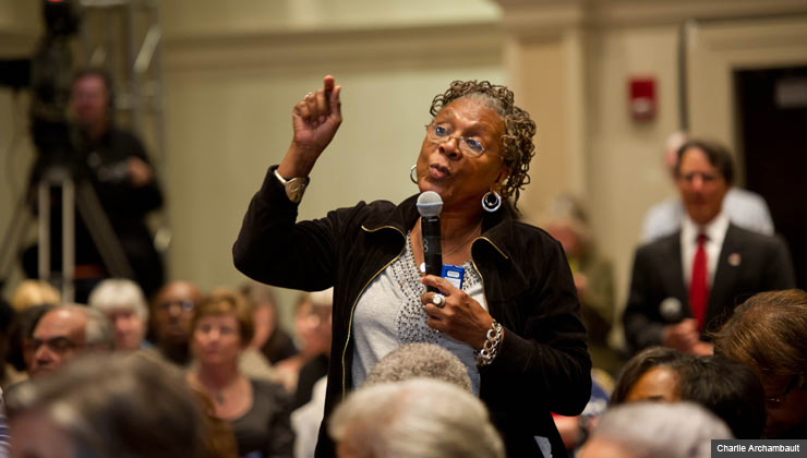 Senior woman speaks about medicare and social security during an AARP event in Richmond, VA on March 20, 2012