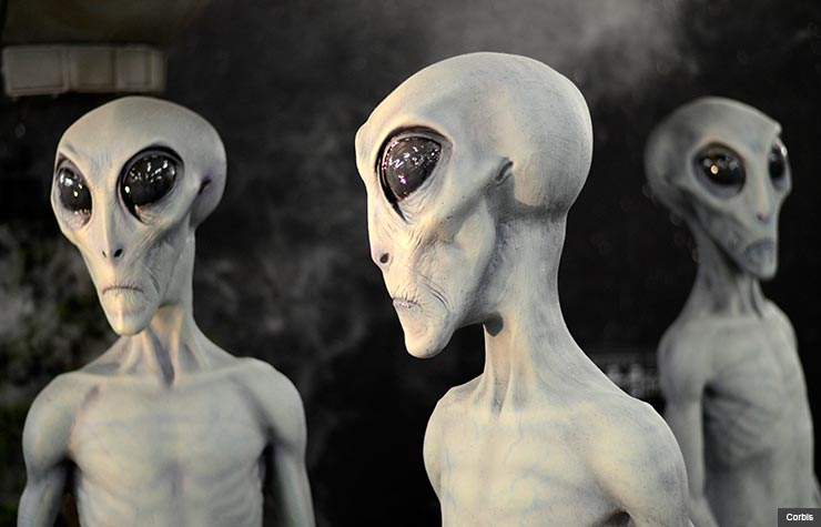 what we believe skeptical aliens ufo heaven hell zombies angels reincarnation ghosts astrology bigfoot apocalypse vampires poll stats belief alien heads (Corbis)