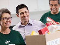 Volunteers collecting food donations. Jobs in demand in nonprofit sector.