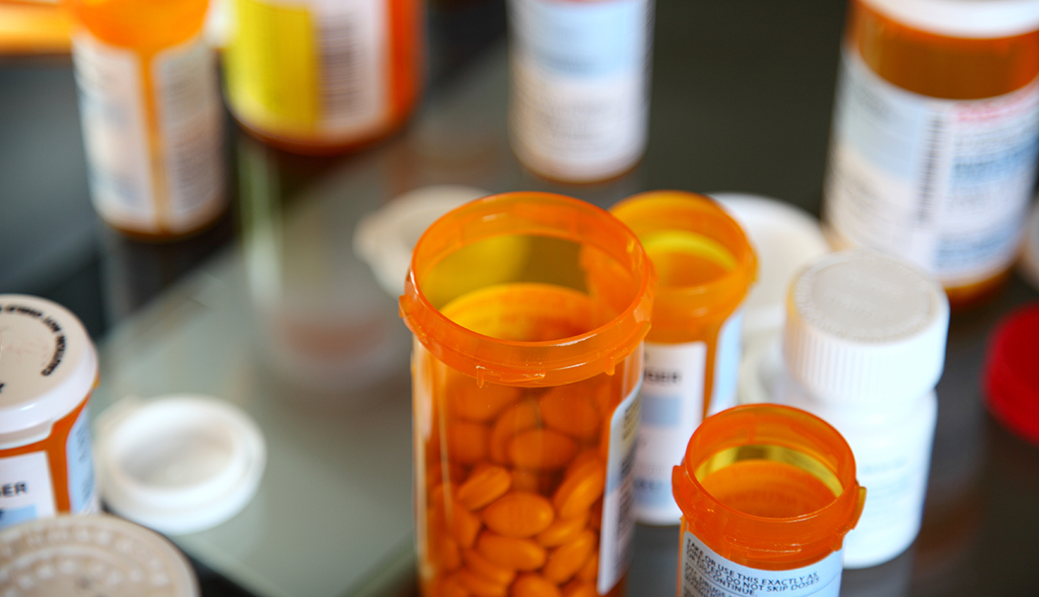 Bottles of prescription drugs are on a table