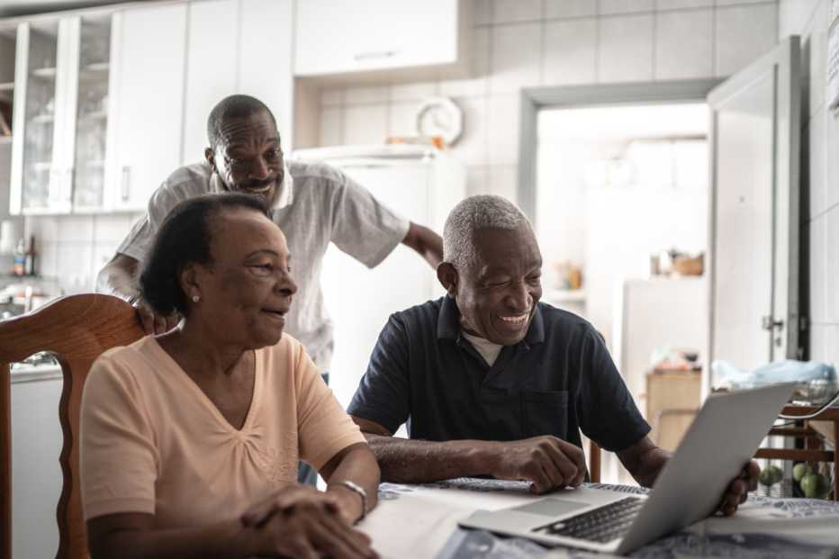 Family on a video calling using laptop at home