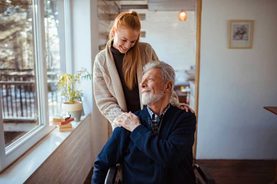 Close up of a daughter helping her father around the house