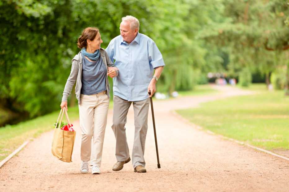 Caregiver â   woman helping senior man with shopping