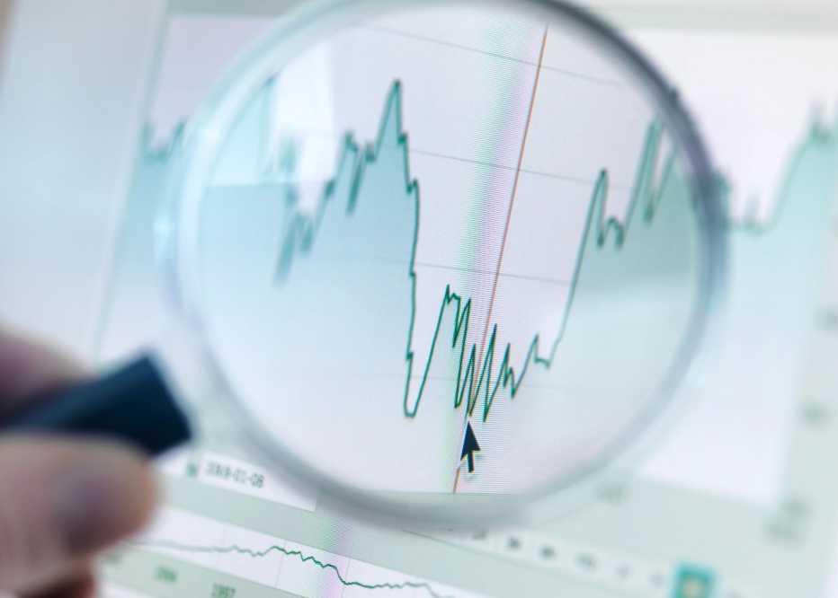 Magnifying glass showing closer view of a graph