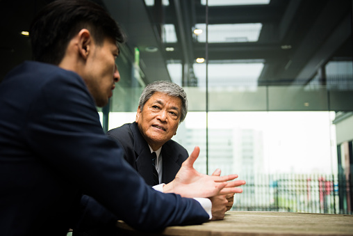Two Asian men having a business meeting