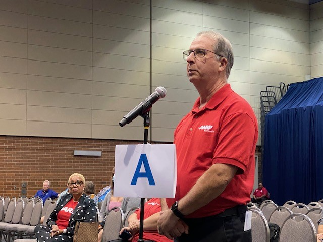 A volunteer from AARP Chicago speaking at a public hearing for utility costs A volunteer from AARP Chicago speaking at a public hearing for utility costs