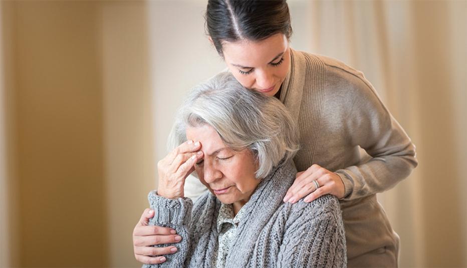 a person putting their hands on the shoulders of someone else
