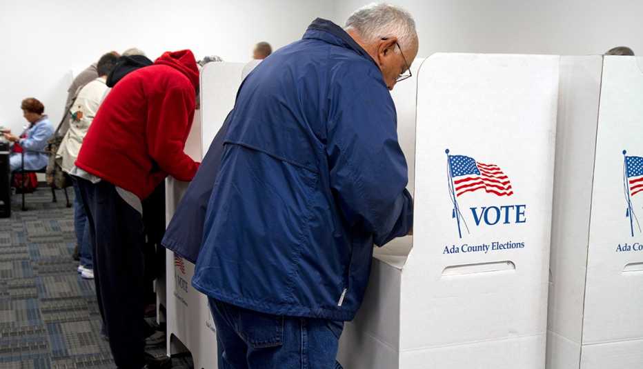 People voting at voting booths during an election