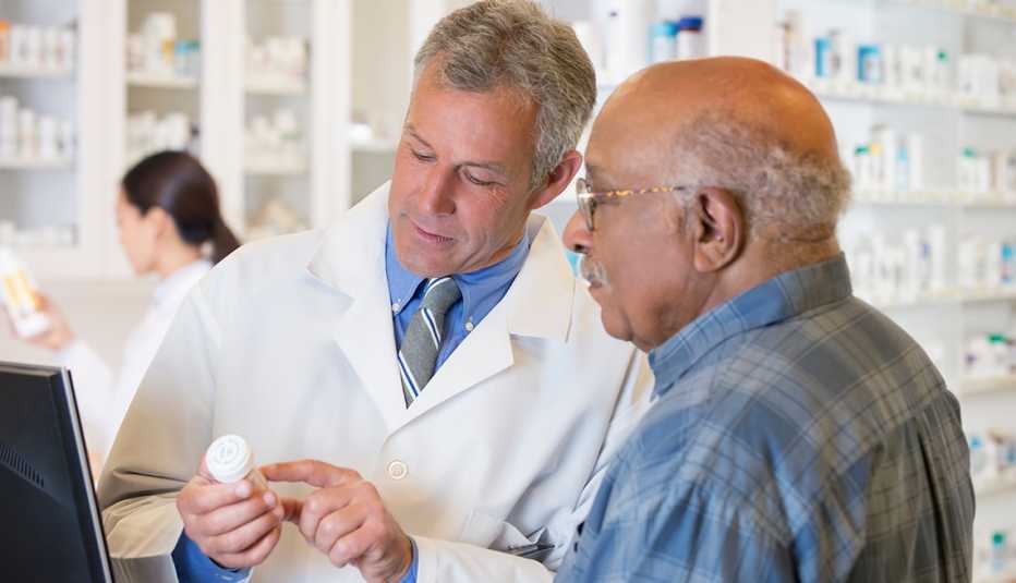 Man buying pills at a pharmacy