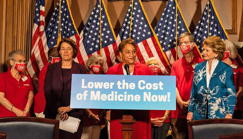 jo an jenkins speaking at a press conference at the u s capitol she is flanked by senators amy klobuchar of minnesota and debbie  stabenow of michigan