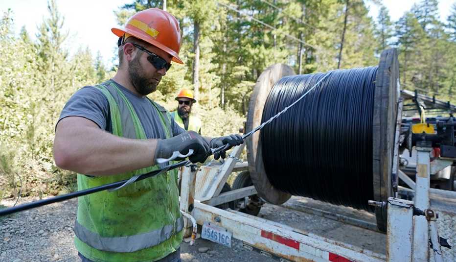 A worker installs cables