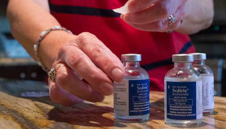 A nurse prepares vials of soliris