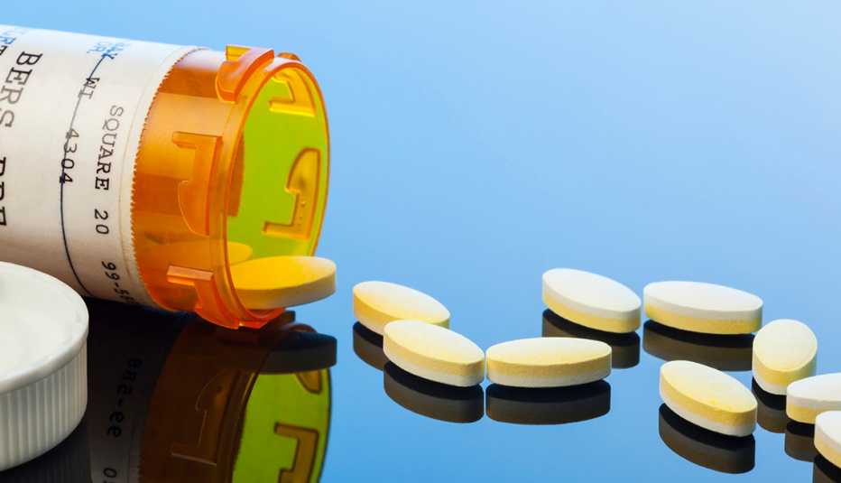 Pills coming out of a bottle