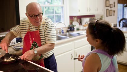 Val Coluni, with granddaughter, was part of a successful AARP lobbying effort to repeal a law that cut unemployment payments to people receiving Social Security.