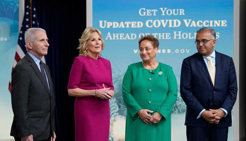 First lady Jill Biden, second from left, speaks during the opening remarks of a virtual White House town hall in the South Court Auditorium on the White House complex in Washington, Friday, Dec. 9, 2022, on getting an updated COVID-19 vaccine this holiday season, especially for Americans ages 50 and older. She is joined by, from left, Dr. Anthony Fauci, the top U.S. infectious disease expert, AARP CEO Jo Ann Jenkins, and White House COVID-19 Response Coordinator Ashish Jha.