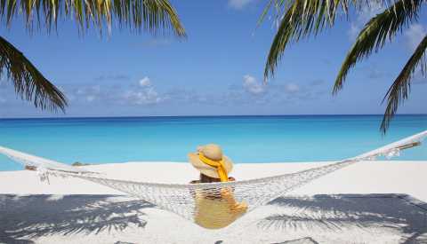 woman relaxing in hammock