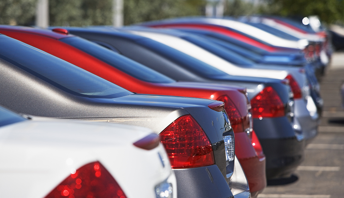 a row of cars on a lot