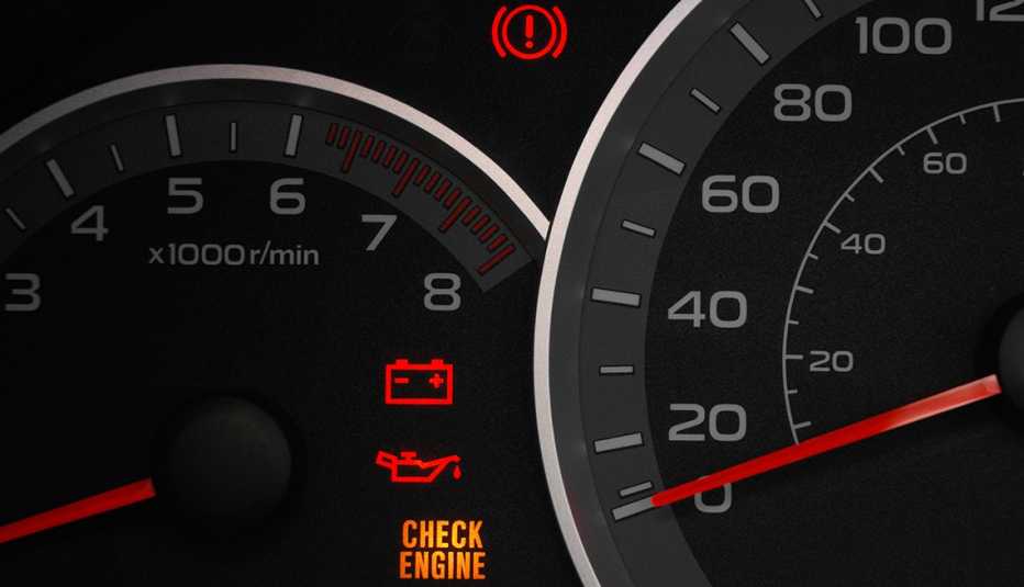 close up of dials and warning lights on a car dashboard