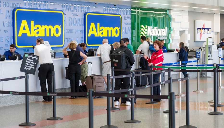 People standing at car rental counter in the Logan International Airport rental car center, Suffolk County, Massachusetts, USA