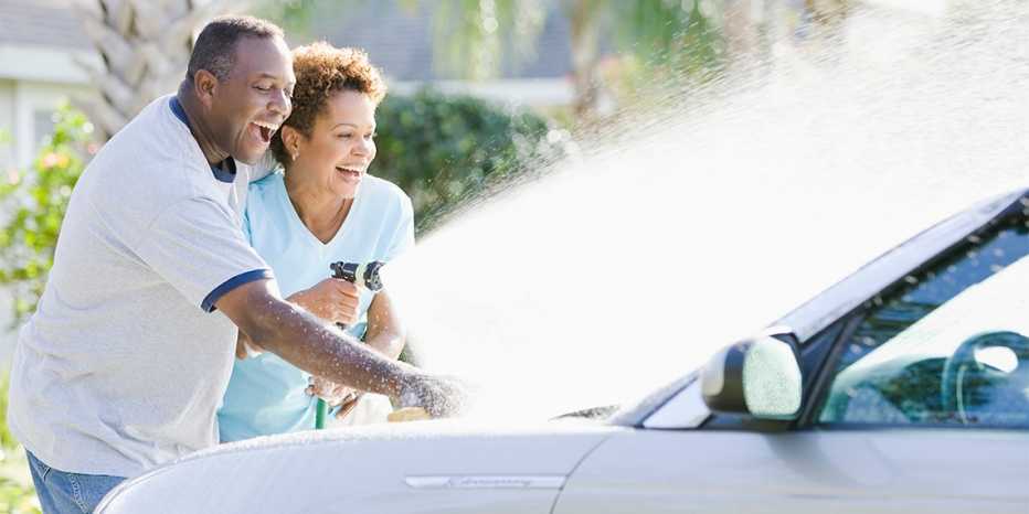 couple washing a car together