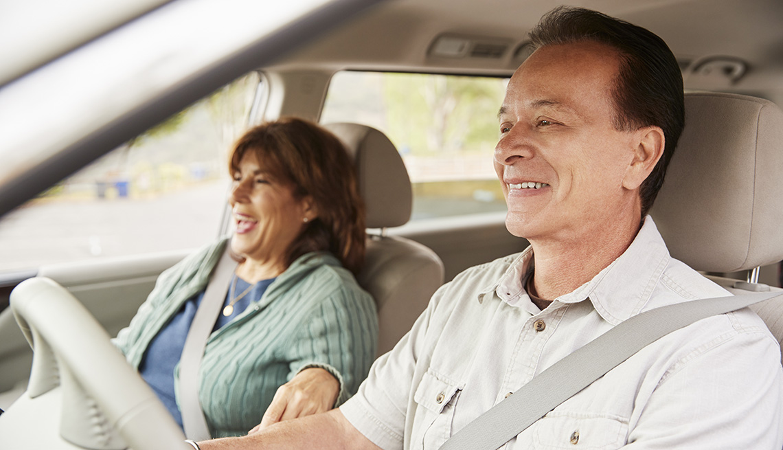 couple smiling in a car