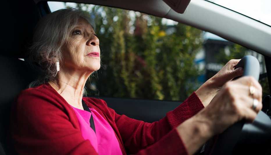 a woman driving a car a woman driving a car