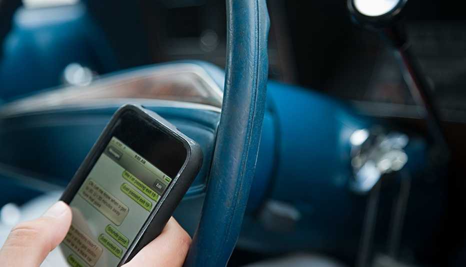 person texting while driving