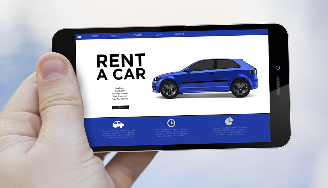 hand holding a phone with a car rental app