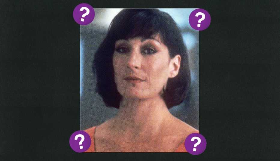 Anjelica Huston; surrounded by purple circles with question marks in them
